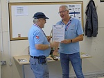 Hedeby awards a certificate to Flying Officer Kyte granting him the rank of Air Vice Marshall (retired).